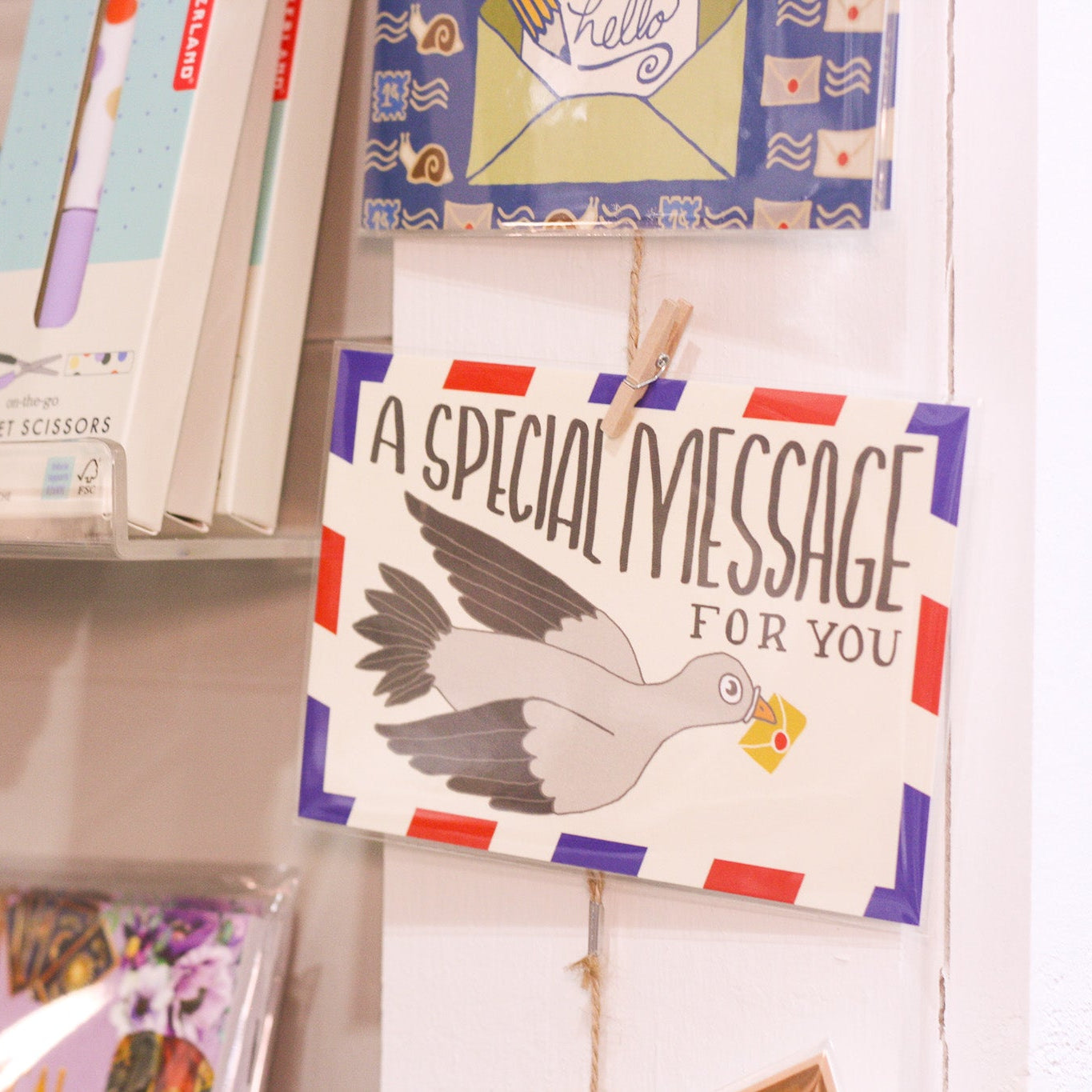 Collection of greeting cards on a shelf with a prominent card reading 'A Special Message For You'.